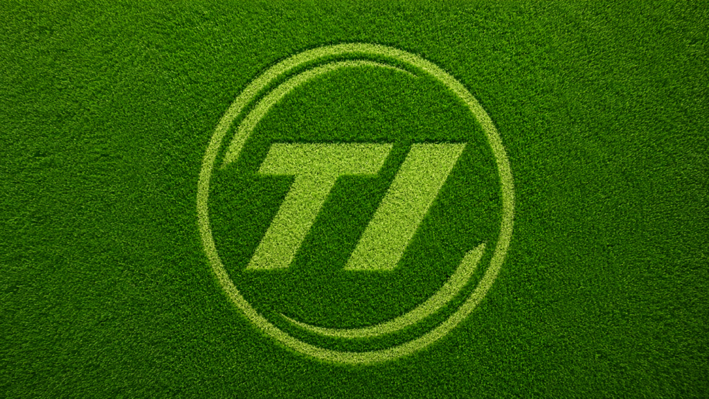 TI Mowers cut into grass